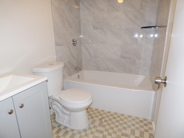 full bathroom with toilet, vanity, tile patterned floors, and tiled shower / bath