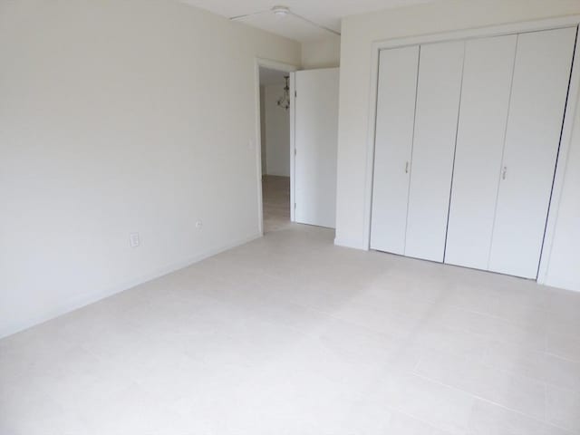 unfurnished bedroom with a closet