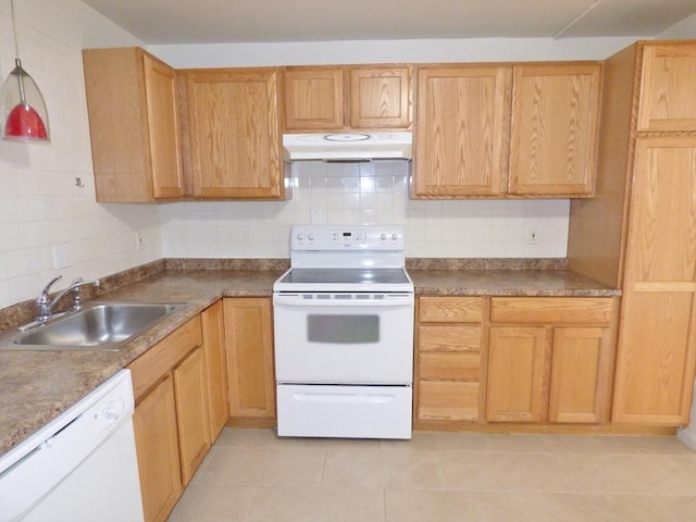 kitchen with white appliances, light brown cabinetry, tasteful backsplash, and sink