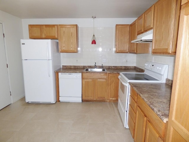 kitchen featuring backsplash, white appliances, sink, and hanging light fixtures