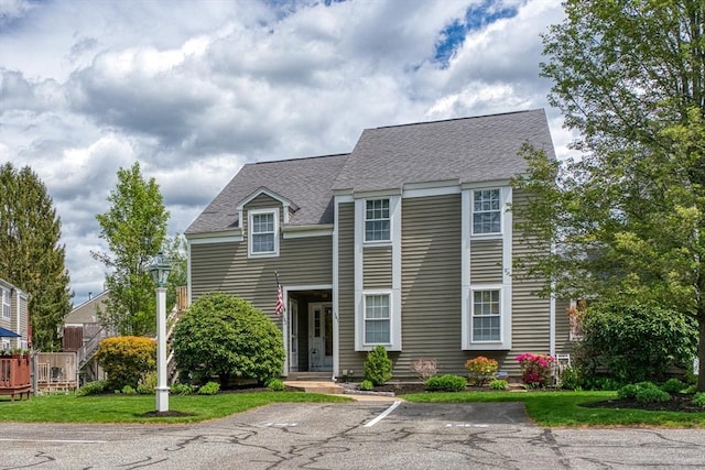141 Shaw Farm Rd Unit 141, Canton, MA 02021 - view of front facade with a shingled roof, uncovered parking, and a front lawn