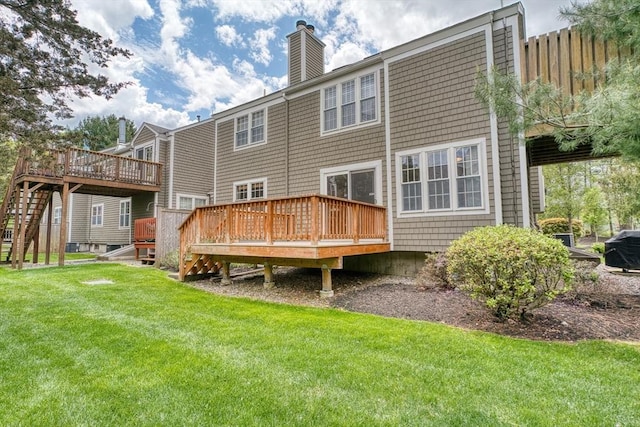 141 Shaw Farm Rd Unit 141, Canton, MA 02021 - rear view of house featuring a deck, a chimney, a yard, and stairway