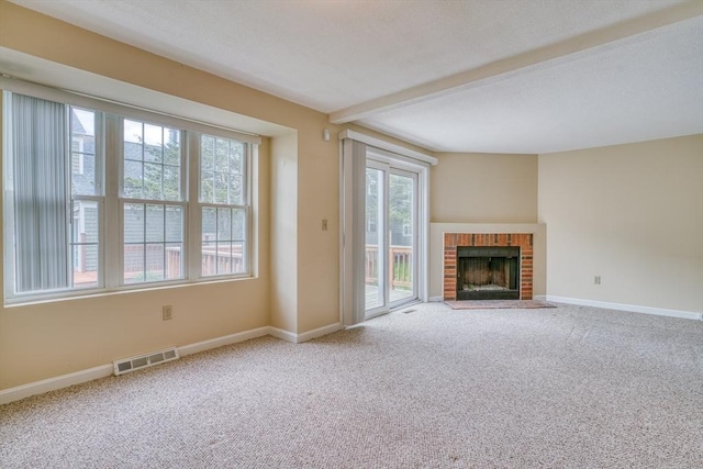 141 Shaw Farm Rd Unit 141, Canton, MA 02021 - unfurnished living room featuring carpet flooring, baseboards, and a brick fireplace