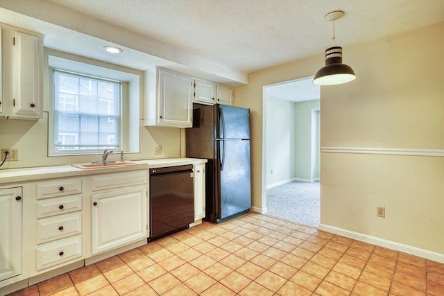 141 Shaw Farm Rd Unit 141, Canton, MA 02021 - kitchen featuring black appliances, a sink, light countertops, hanging light fixtures, and baseboards