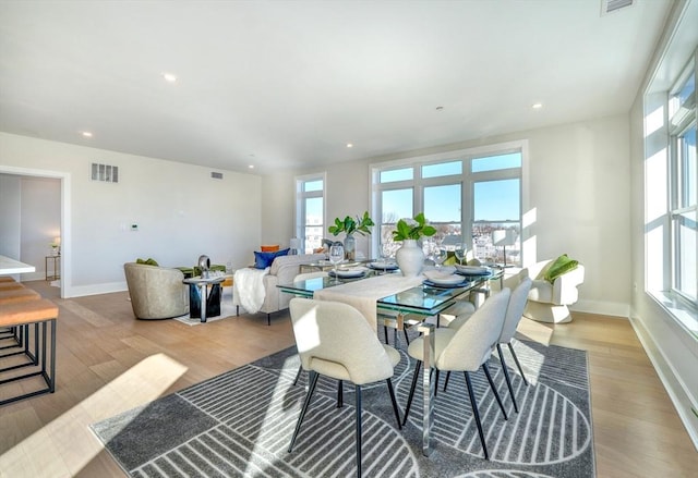 62 Foundry St Unit 215, Wakefield, MA 01880 - dining space with healthy amount of natural light, wood finished floors, and recessed lighting