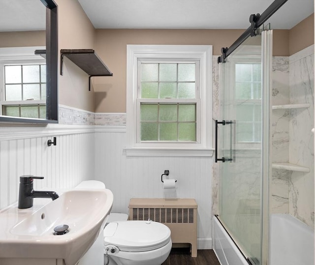 83 Summit Rd, Abington, MA 02351 - bathroom featuring a sink, radiator, a wainscoted wall, enclosed tub / shower combo, and toilet