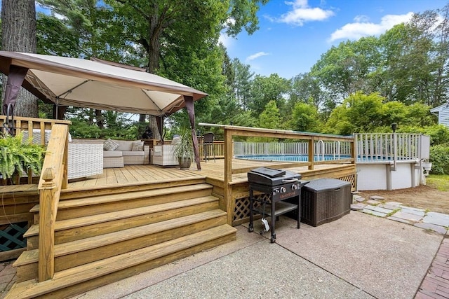 83 Summit Rd, Abington, MA 02351 - wooden terrace with an outdoor hangout area, an outdoor pool, view of wooded area, a patio area, and area for grilling