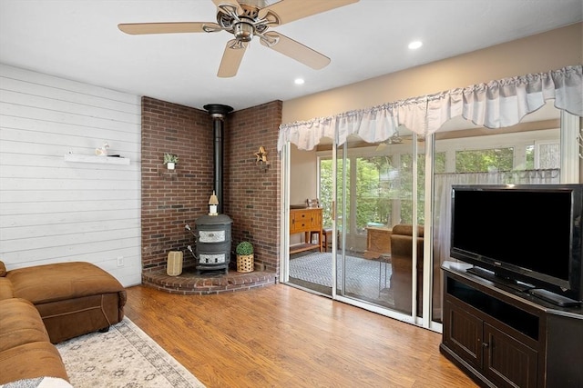 83 Summit Rd, Abington, MA 02351 - living room featuring a wood stove, light wood finished floors, ceiling fan, and recessed lighting