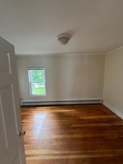 10 Stevens St, Lawrence, MA 01843 - unfurnished room featuring wood finished floors, crown molding, a baseboard radiator, and baseboards