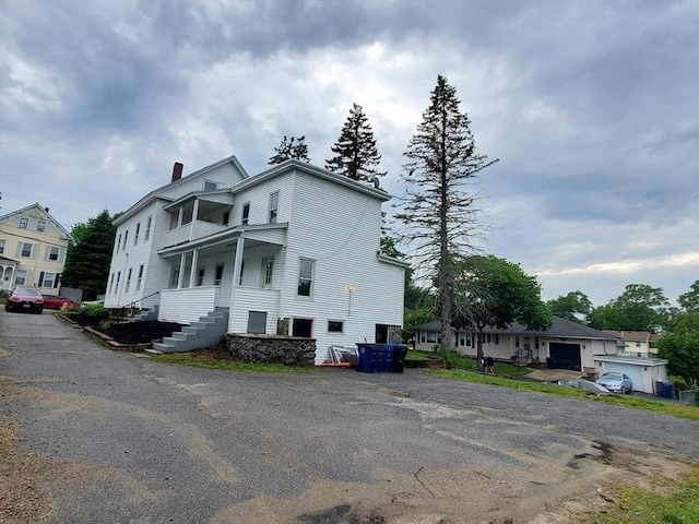 10 Stevens St, Lawrence, MA 01843 - view of home's exterior featuring a balcony and a chimney