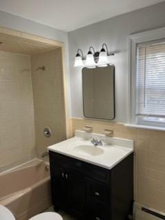10 Stevens St, Lawrence, MA 01843 - full bathroom featuring toilet, a baseboard radiator, vanity, and shower / washtub combination