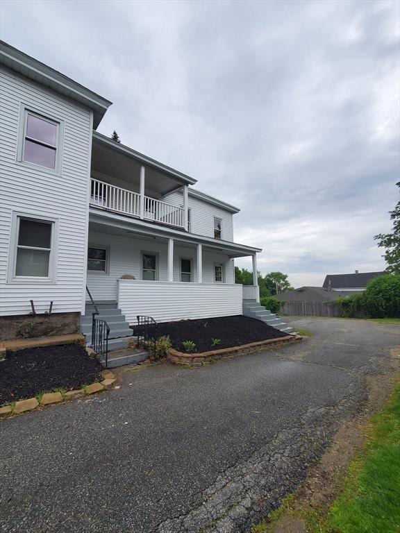 10 Stevens St, Lawrence, MA 01843 - view of front of house with a balcony and covered porch