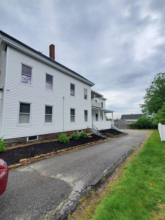 10 Stevens St, Lawrence, MA 01843 - view of side of home featuring a chimney