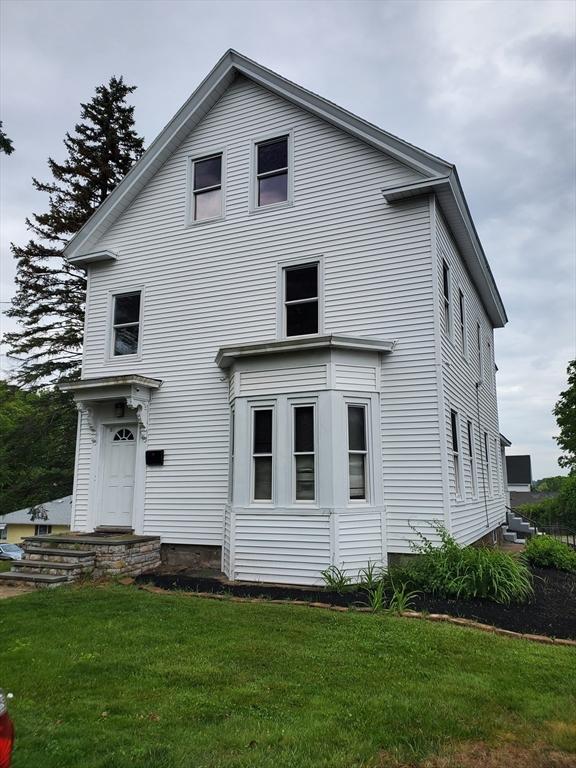 10 Stevens St, Lawrence, MA 01843 - back of property featuring a yard