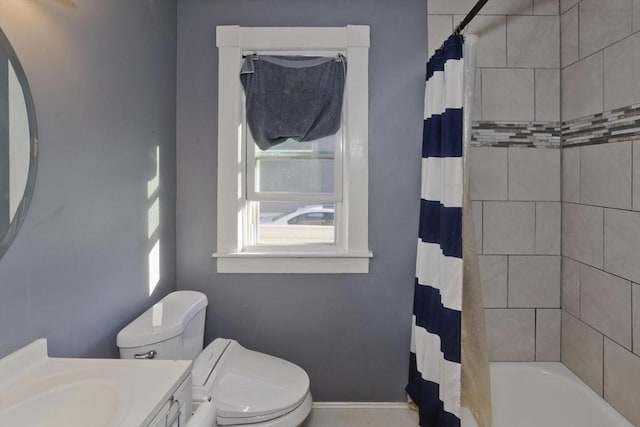 full bath with toilet, shower / bath combo, and vanity