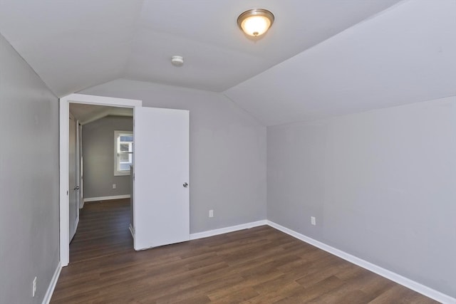 bonus room featuring lofted ceiling and dark wood-type flooring