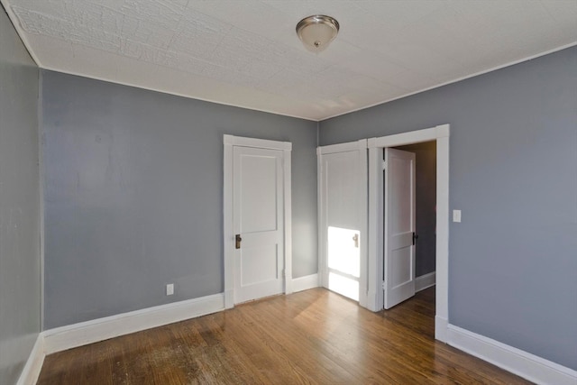 unfurnished bedroom featuring hardwood / wood-style flooring