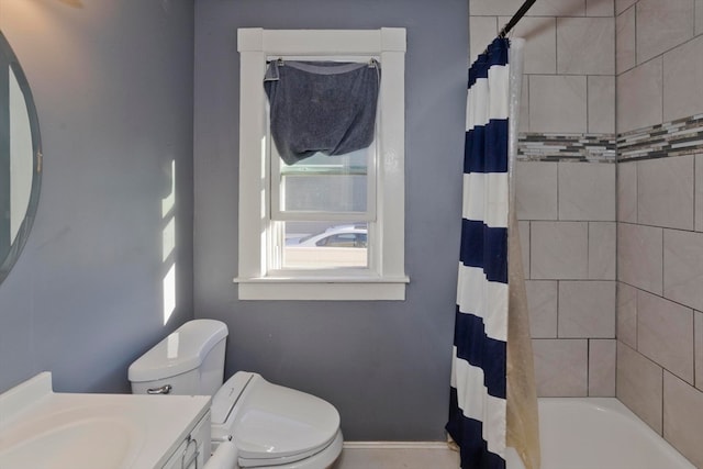 full bathroom with vanity, toilet, and shower / bath combo