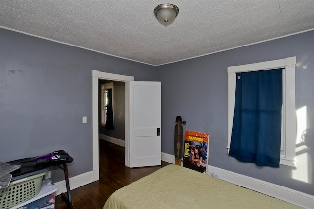 bedroom featuring dark hardwood / wood-style flooring