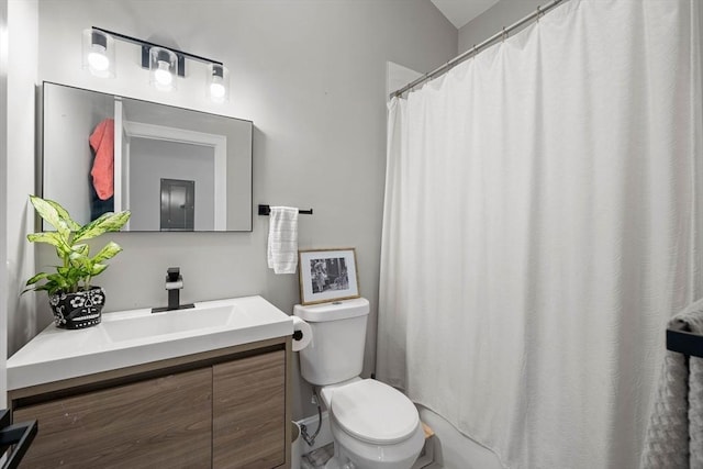 bathroom featuring walk in shower, vanity, and toilet