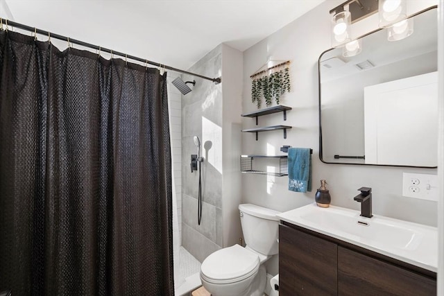 bathroom featuring vanity, curtained shower, and toilet