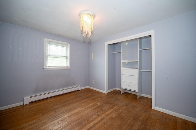 3 Sears Ave, Webster, MA 01570 - unfurnished bedroom with baseboard heating, wood finished floors, and a closet