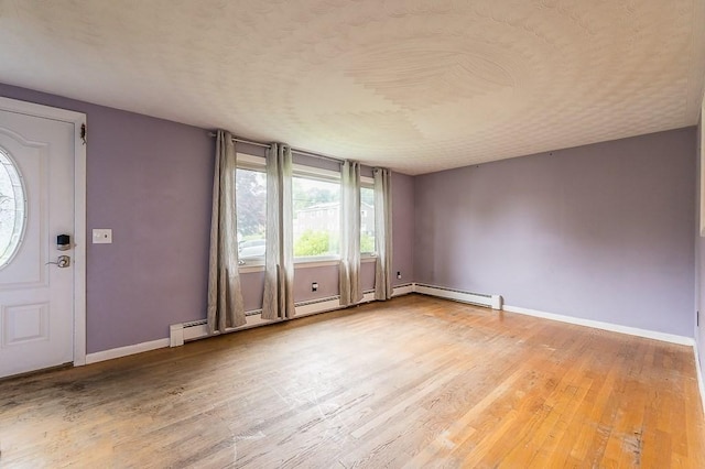 3 Sears Ave, Webster, MA 01570 - entrance foyer featuring light wood-type flooring and a baseboard heating unit