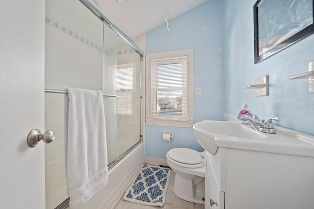 full bathroom featuring bath / shower combo with glass door, lofted ceiling, toilet, tile patterned flooring, and vanity