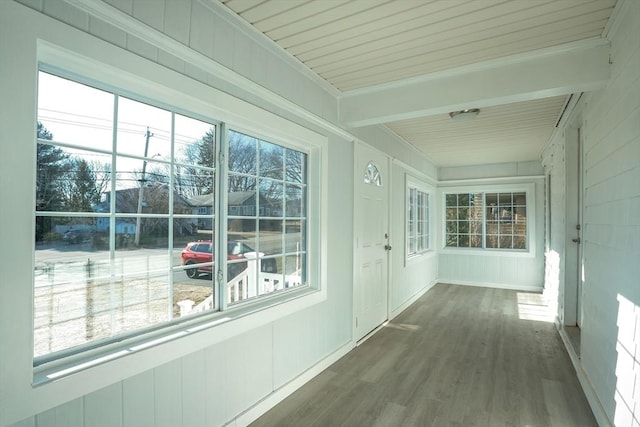 unfurnished sunroom featuring a wealth of natural light