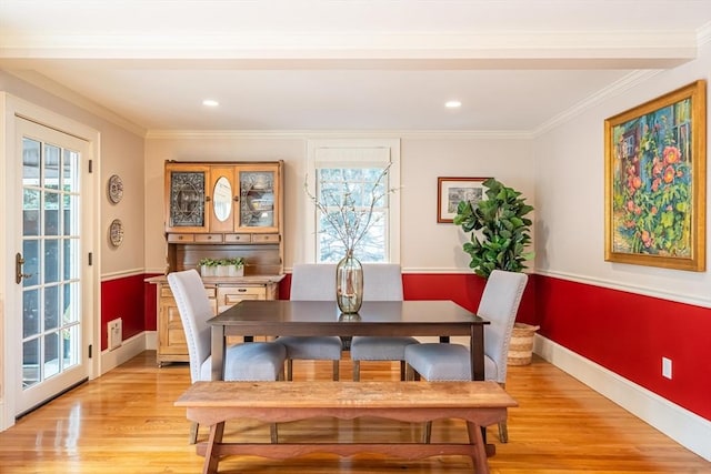 dining room featuring recessed lighting, baseboards, ornamental molding, and light wood-type flooring