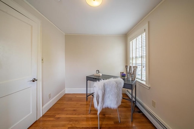 interior space featuring crown molding, baseboards, wood finished floors, and a baseboard radiator