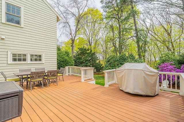 deck with outdoor dining area