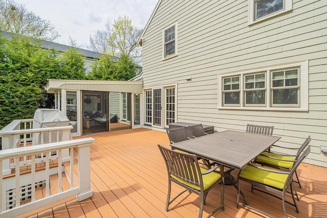 wooden deck featuring outdoor dining space