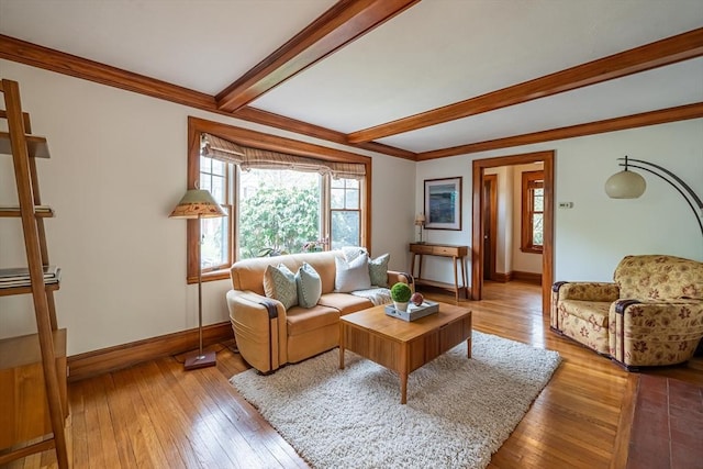 living room featuring baseboards, plenty of natural light, hardwood / wood-style flooring, and beamed ceiling