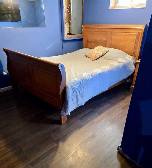 bedroom featuring dark wood-type flooring