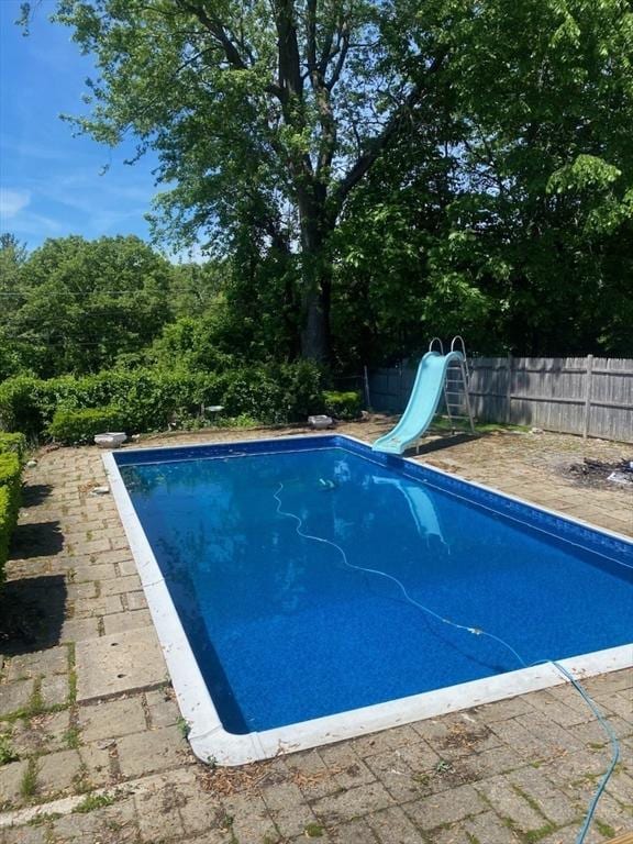 view of swimming pool featuring a water slide