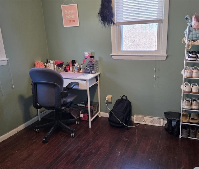 home office with wood-type flooring