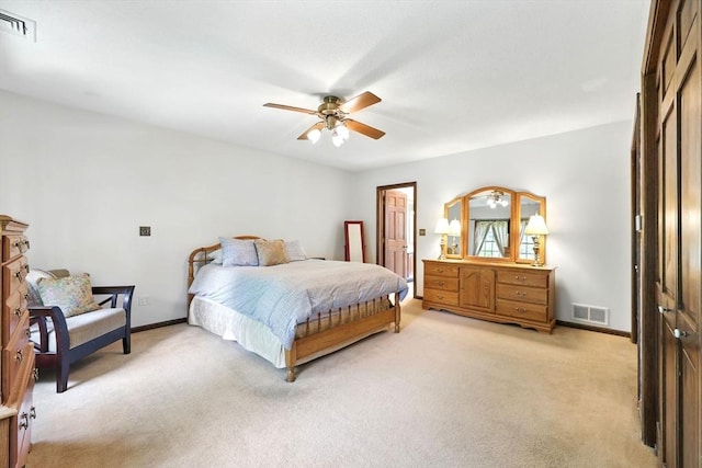 bedroom with light colored carpet, baseboards, and ceiling fan