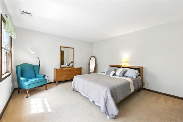 carpeted bedroom with baseboards