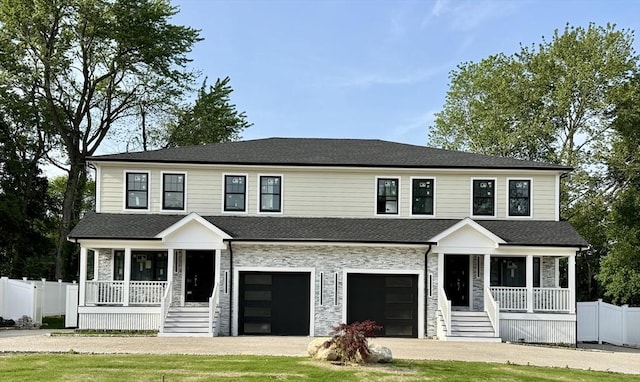 50 Summer Unit A, Bedford, MA 01730 - view of front facade featuring a porch, an attached garage, dirt driveway, stone siding, and stairway