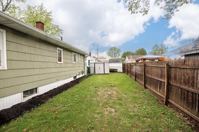 view of yard with a shed and an outbuilding