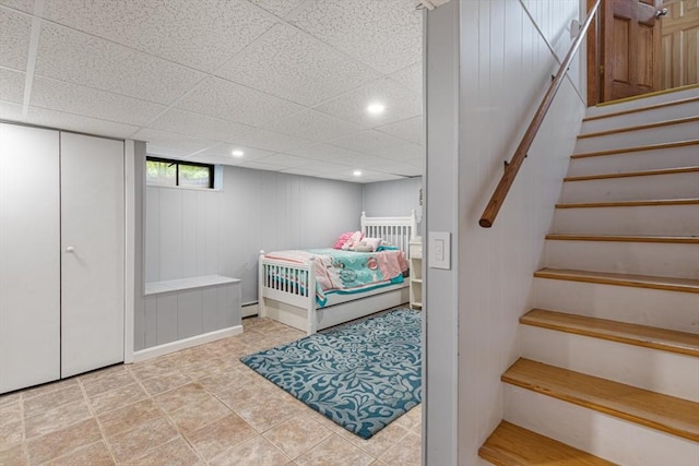 bedroom with recessed lighting and a baseboard radiator