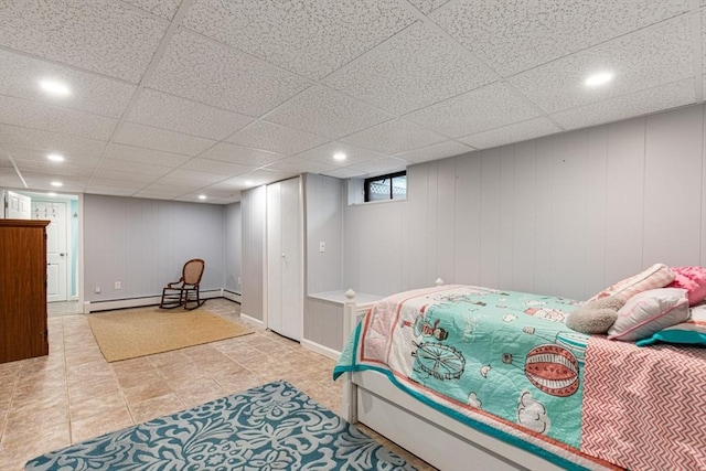 bedroom featuring recessed lighting and a baseboard radiator