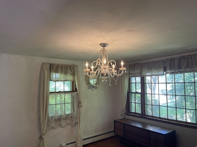 53 Beechwood St, Cohasset, MA 02025 - unfurnished dining area featuring a baseboard radiator and a chandelier