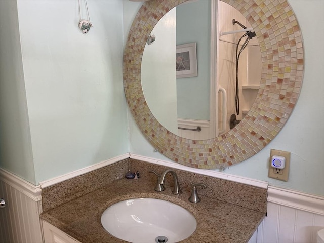 53 Beechwood St, Cohasset, MA 02025 - bathroom featuring wainscoting, a decorative wall, and vanity