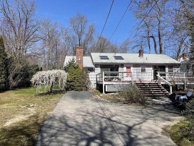 53 Beechwood St, Cohasset, MA 02025 - view of front of property with a chimney and a wooden deck