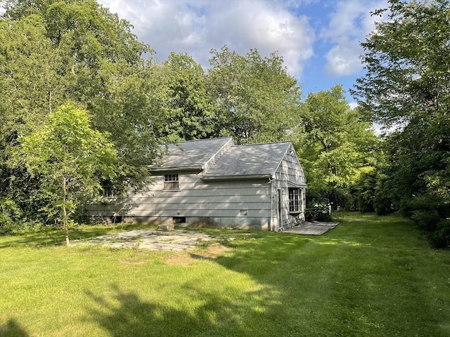 53 Beechwood St, Cohasset, MA 02025 - view of property exterior with a lawn and roof with shingles