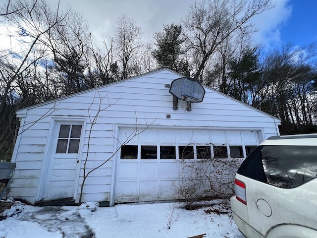 view of snow covered garage