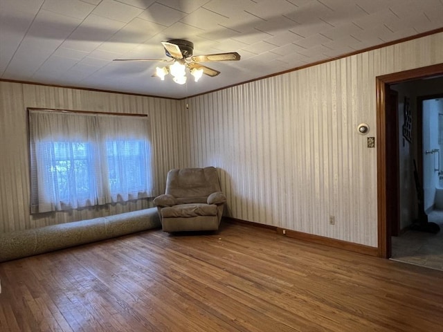 unfurnished room featuring crown molding, ceiling fan, and hardwood / wood-style floors