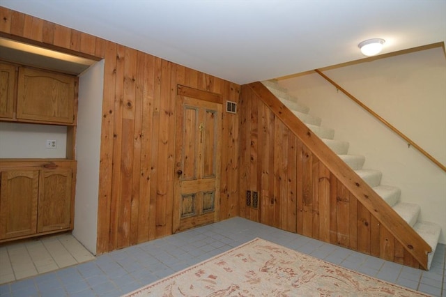 17 Bayberry Cir Unit 17, Millis, MA 02054 - stairway featuring wood walls and tile patterned flooring
